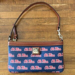 Brand new Dooney and Burke Ole Miss clutch. Never been used.